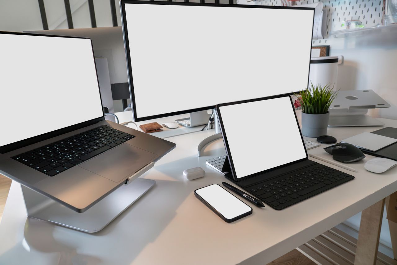 hero-img A clean and modern workspace featuring a laptop, tablet, smartphone, and monitor. Ideal for remote work and tech setups.